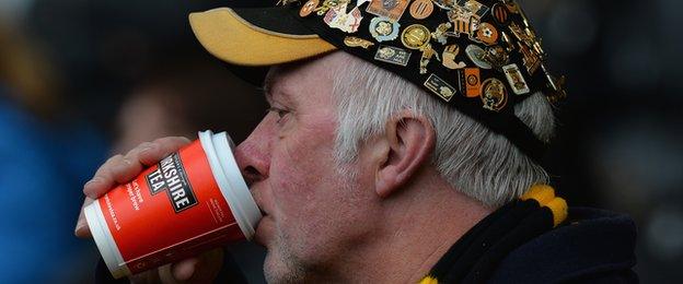 A fan drinks a tea