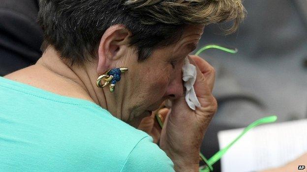 Viviane Lambert, mother of Vincent Lambert, wipes a tear as she listens to a verdict about her son in the European Court of Human Rights in Strasbourg, eastern France, Friday, 5 June 2015