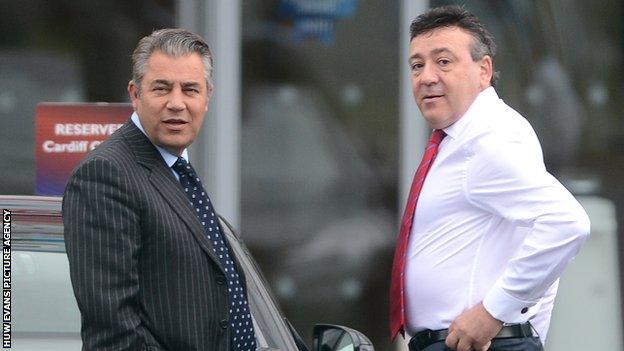 Cardiff City chairman Mehmet Dalman (L) with Michael Filiou