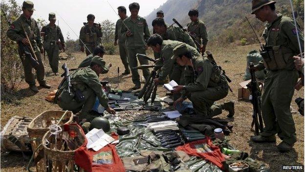 Rebel soldiers of Myanmar National Democratic Alliance Army (MNDAA) patrol near a military base in Kokang region, March 10, 2015.