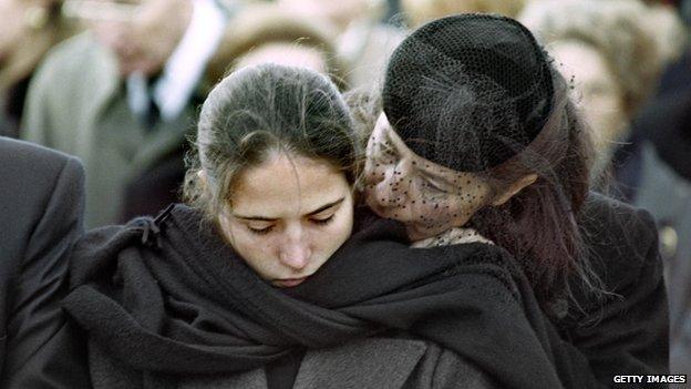 Mitterand's illegitimate daughter Mazarine Pingeot is comforted by her mother at the president's funeral