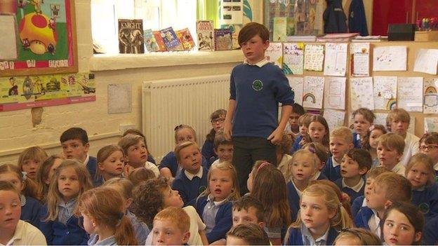 Boy standing in class