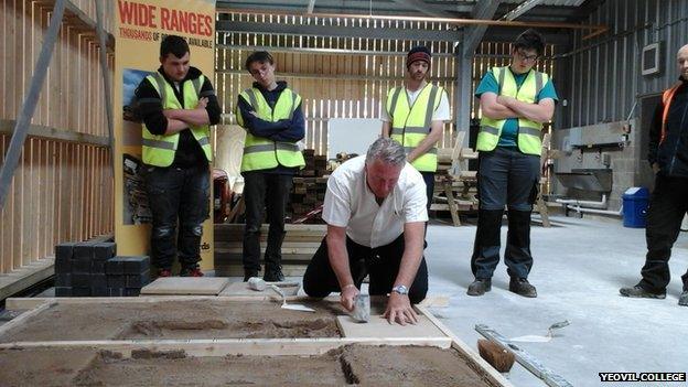 Yeovil College new construction skills centre (picturing Tommy Walsh showing off paving skills to students there during the opening day)