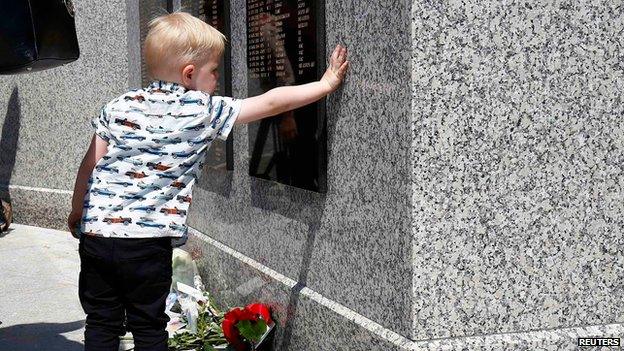 Three-year-old Jake Thackary pays tribute to uncle Jake Alderton after the service of dedication