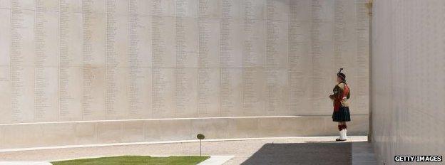 A member of the military observes the Armed Forces Memorial