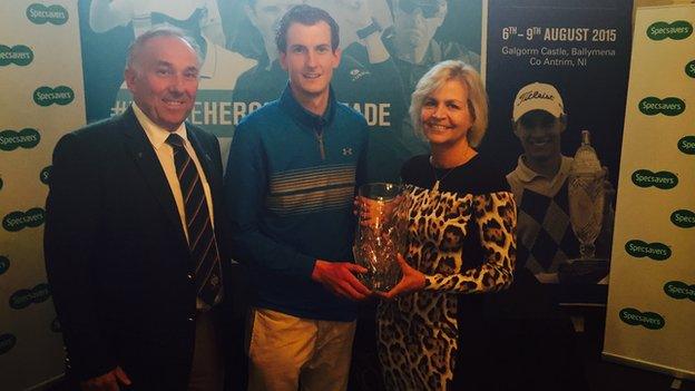 Tiarnan McLarnon receives the North of Ireland Strokeplay trophy from Valerie Penney, with Galgfrom Castle's captain Keith Dinsmore also in the picture