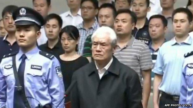 This screen grab taken from CCTV footage shows former Chinese security chief Zhou Yongkang (front) standing on trial at the Intermediate People"s Court in Tianjin 11 June 2015