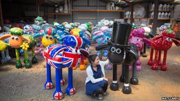 Shaun the Sheep sculptures in a barn