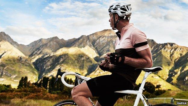 A cyclist wearing Rapha clothing