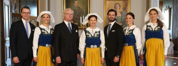 The Swedish Royal family, from left Prince Daniel, Crown Princess Victoria, King Carl Gustaf, Queen Silvia, Prince Carl Philip, his fiancee Sofia Hellqvist and Princess Madeleine pose for a photograph during a reception at the Royal Palace during the National Day of Sweden celebrations in Stockholm Saturday, June 6, 2015