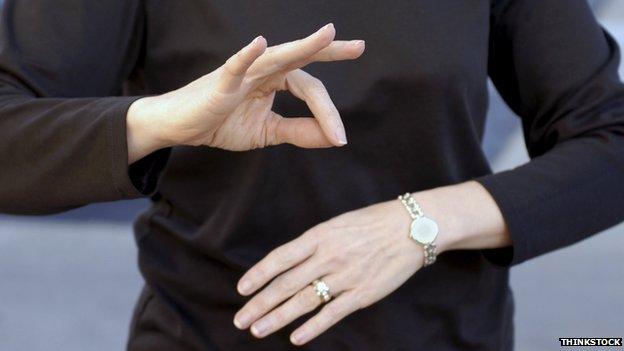 A man doing sign language