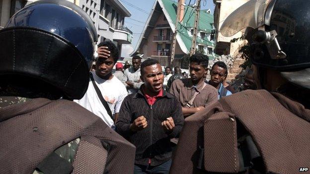 Protesters confront Malagasy Police forces as they take position around the Constitutional High Court