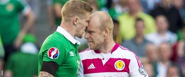 Ireland's James McClean and Scotland striker Steven Naismith display the kind of aggression that bubbled away throughout the match