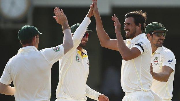 Mitchell Starc celebrates taking a wicket