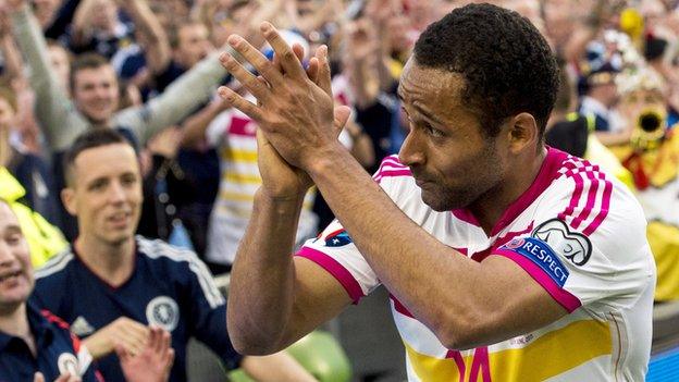 Ikechi Anya celebrates with Scotland fans in Dublin