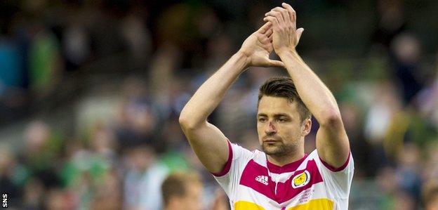 Russell Martin celebrates with the Scotland fans