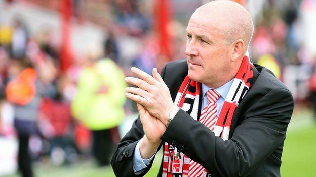 Mark Warburton applauds the Brentford support