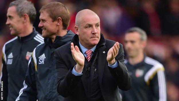 Mark Warburton applauds the Brentford support