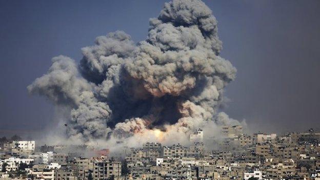 File photo: Smoke and fire from an Israeli strike rise over Gaza City, 29 July 2014