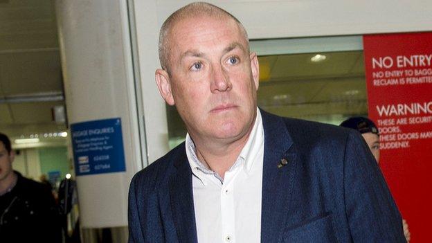 Mark Warburton arrives at Glasgow Airport