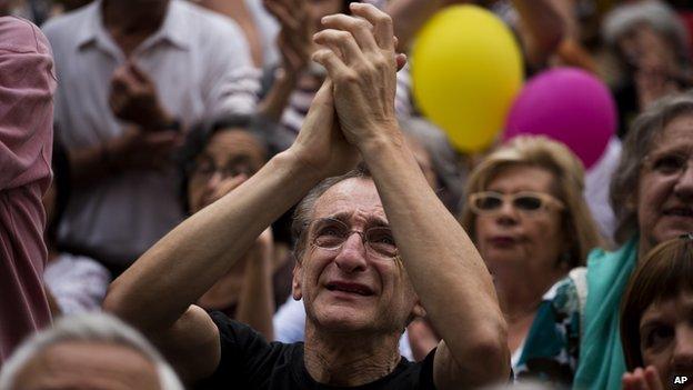 People react in front of the city town building to support the leader of leftist coalition Barcelona Together, Ada Colau