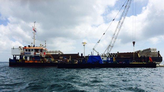 Barge carrying out installation work on one of the new outfall pipes at Belle Greve