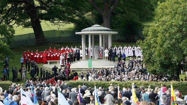 Soldiers stand next to a Magna Carta memorial during an event marking the 800th anniversary of Magna Carta in Runnymede