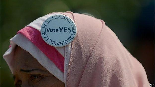 A Philippine Muslim supporting the peace accord between the government and the Moro Islamic liberation Front (MILF) attends a rally to press for the passage of the Bangsamoro Basic law that will implement the peace treaty in front of the Philippine Senate on June 3, 2015.