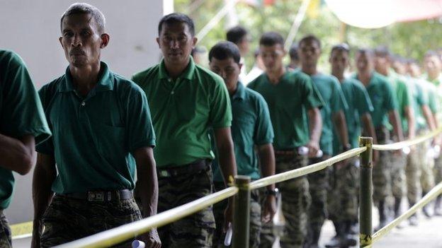 Some of the 145 fighters from the Moro Islamic Liberation Front (MILF) march during the first phase of the decommissioning of rebel weapons in the town of Sultan Kudarat, Maguindanao province, Southern Philippines, 16 June 2015.