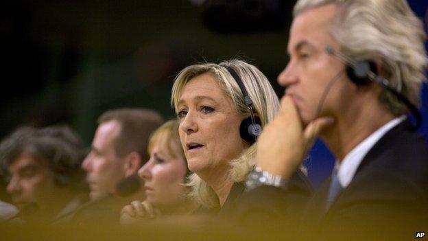 National Front leader Marine Le Pen, second right, speaks during a media conference at the European Parliament in Brussels on Tuesday, 16 June 2015