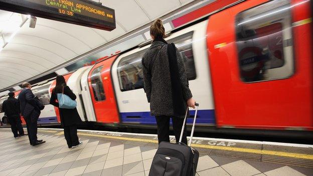 Commuters at a London Underground station