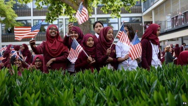 Pupils at the Mulberry School for Girls waved British and American flags ahead of Mrs Obama's visit