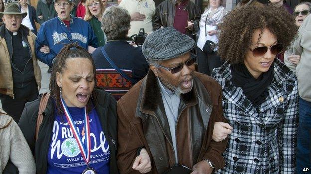 Rachel Dolezal sings the civil rights anthem "We Shall Overcome" at a rally in March 20156 March 2015