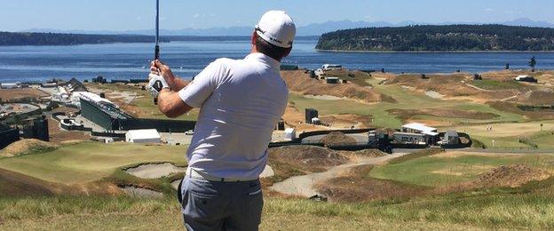 Graeme McDowell hits a tee shot at the ninth at the spectacular Chambers Bay near Seattle