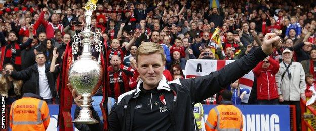 Eddie Howe celebrates with the Championship trophy