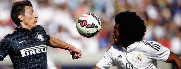 Derik (right) in action for Real Madrid B