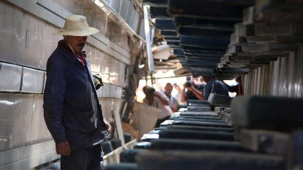 A worker in an upturned carriage in Tunisia
