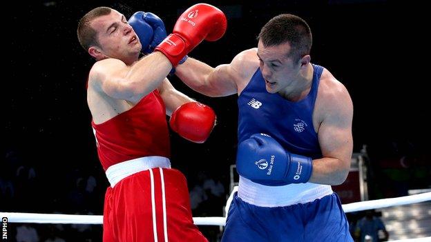 Darren O'Neill lands a strong right hand on Romania's Ionut Jitaru