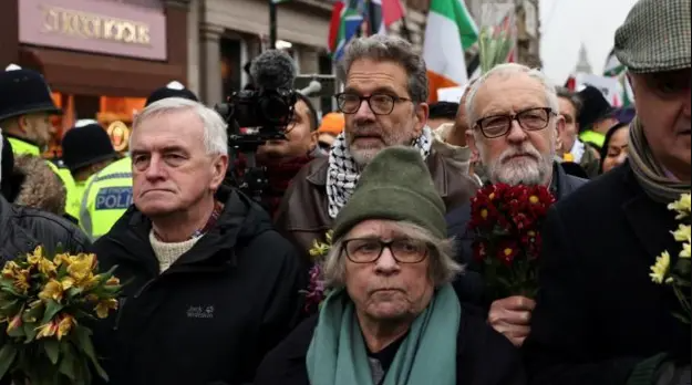 Five protesters, including John McDonnell and Jeremy Corbyn in a crowd outside