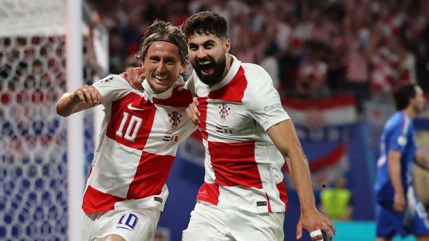 Modric and Gvardiol celebrate