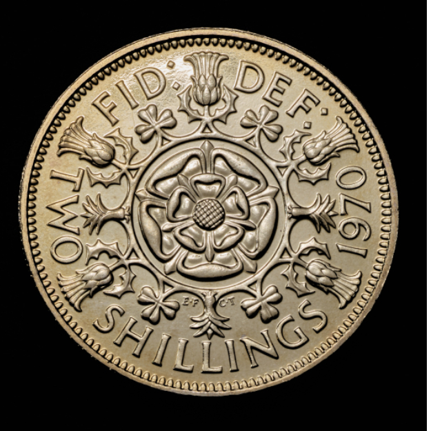 The British florin on a black background. 