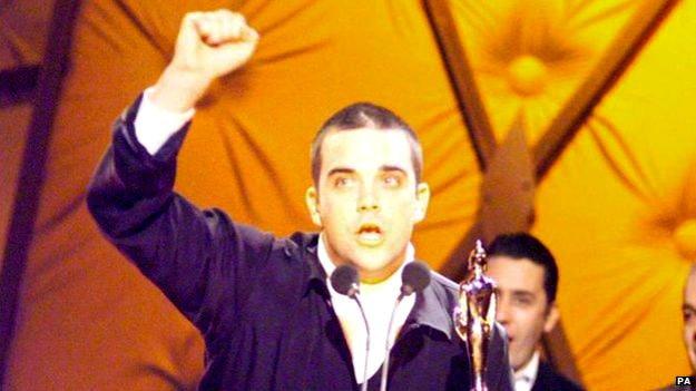 Robbie Williams at the Brit Awards 1999