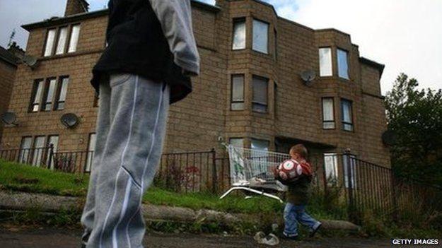 Boys playing outside a block of flats