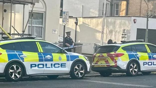 Police outside a property in Brighton & Hove earlier this week 