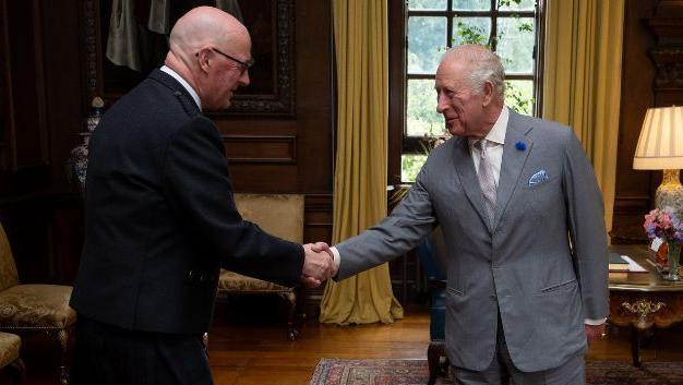 John Swinney meeting King Charles III at the Palace of Holyroodhouse in Edinburgh.