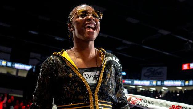 Claressa Shields enters the ring smiling