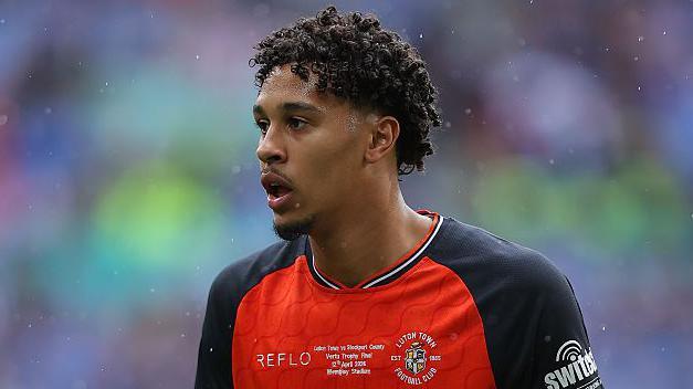 Emilio Lawrence in an orange and black Luton Town jersey during the 2026 EFL Trophy at Wembley Stadium.