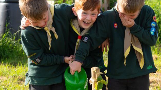 1st Wychwoods Scout Group cubs and beavers looking after fruit trees 