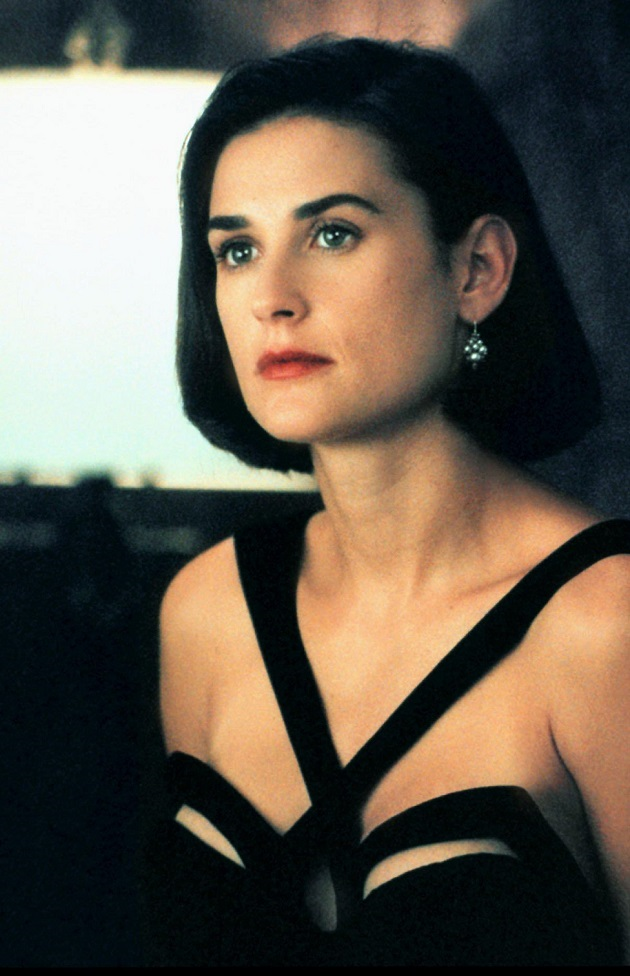 Demi Moore wearing a black Mugler dress in 1993's Indecent Proposal