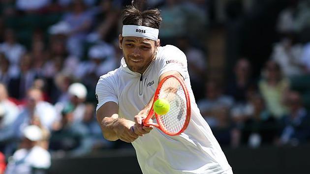 Taylor Fritz in action against Karen Khachanov at Wimbledon